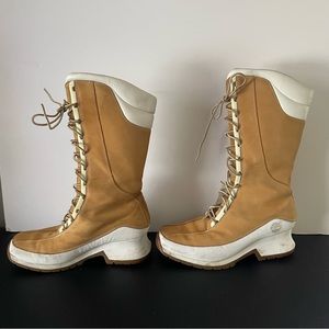 Timberland tan lace up wedge heel boots size 9.